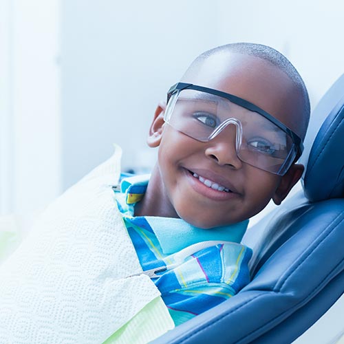 boy receives an oral exam general dentistry in Brampton